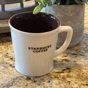 Starbucks 2009 New bone China coffee mug. Interior brown and brown lettering.